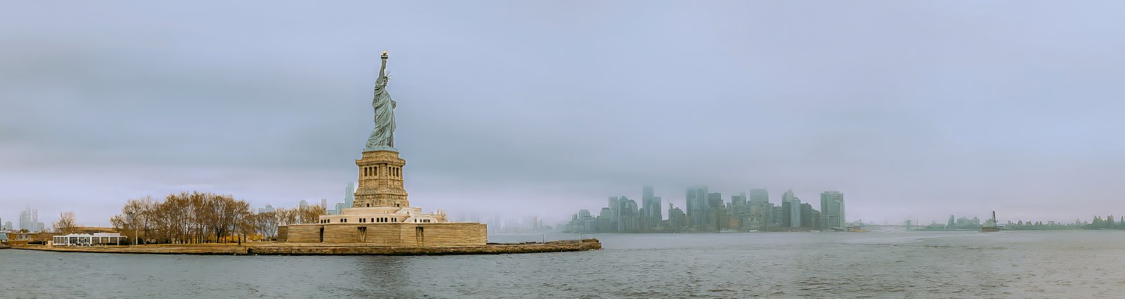 Statue of Liberty with the Manhattan skyline across New York Harbor